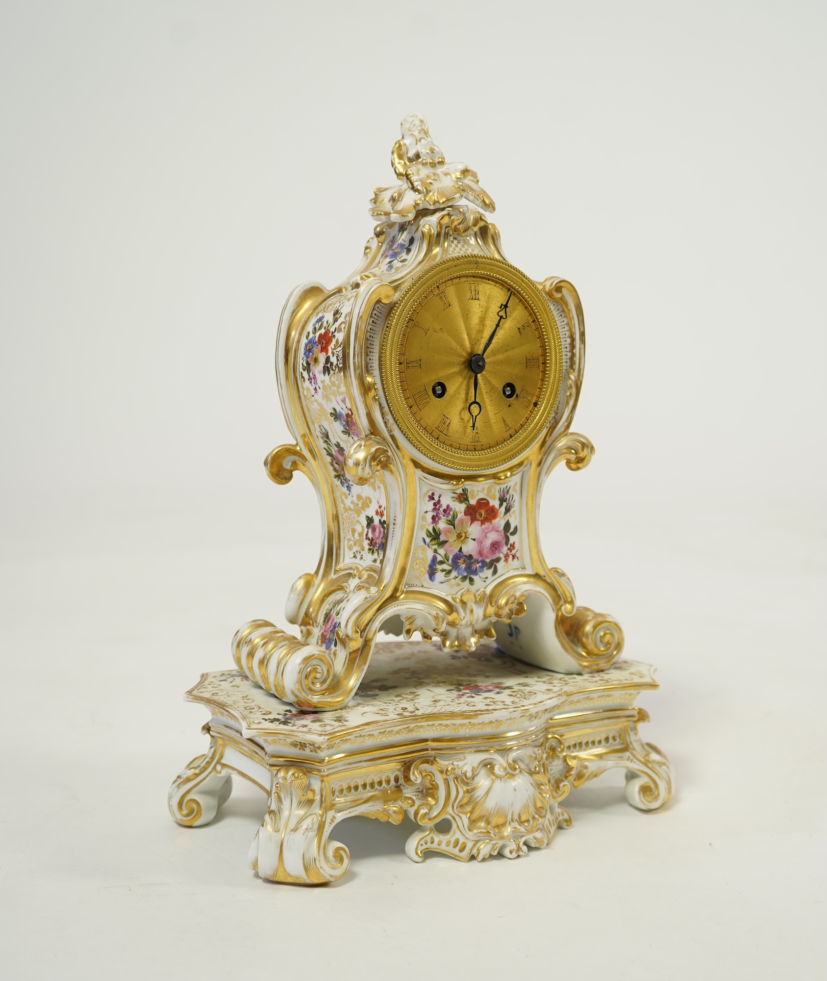A mid 19th century French porcelain floral and gilt decorated clock, by Jacob Petit
